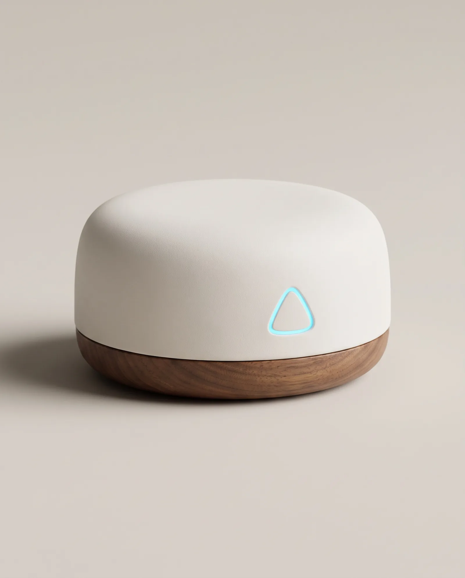 The ALYT hub, matte white on a walnut base, studio shot